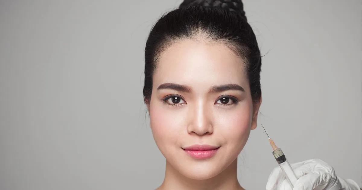 Injector administering Botox to forehead lines during cosmetic treatment